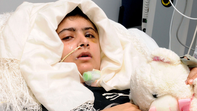 Malala Yousafzai lying in hospital bed
